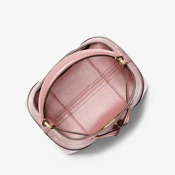 MICHAEL KORS
Mercer Small Logo Embossed Leather Bucket Bag
COLOR PRIMROSE 
NWT - Picture 2 of 4